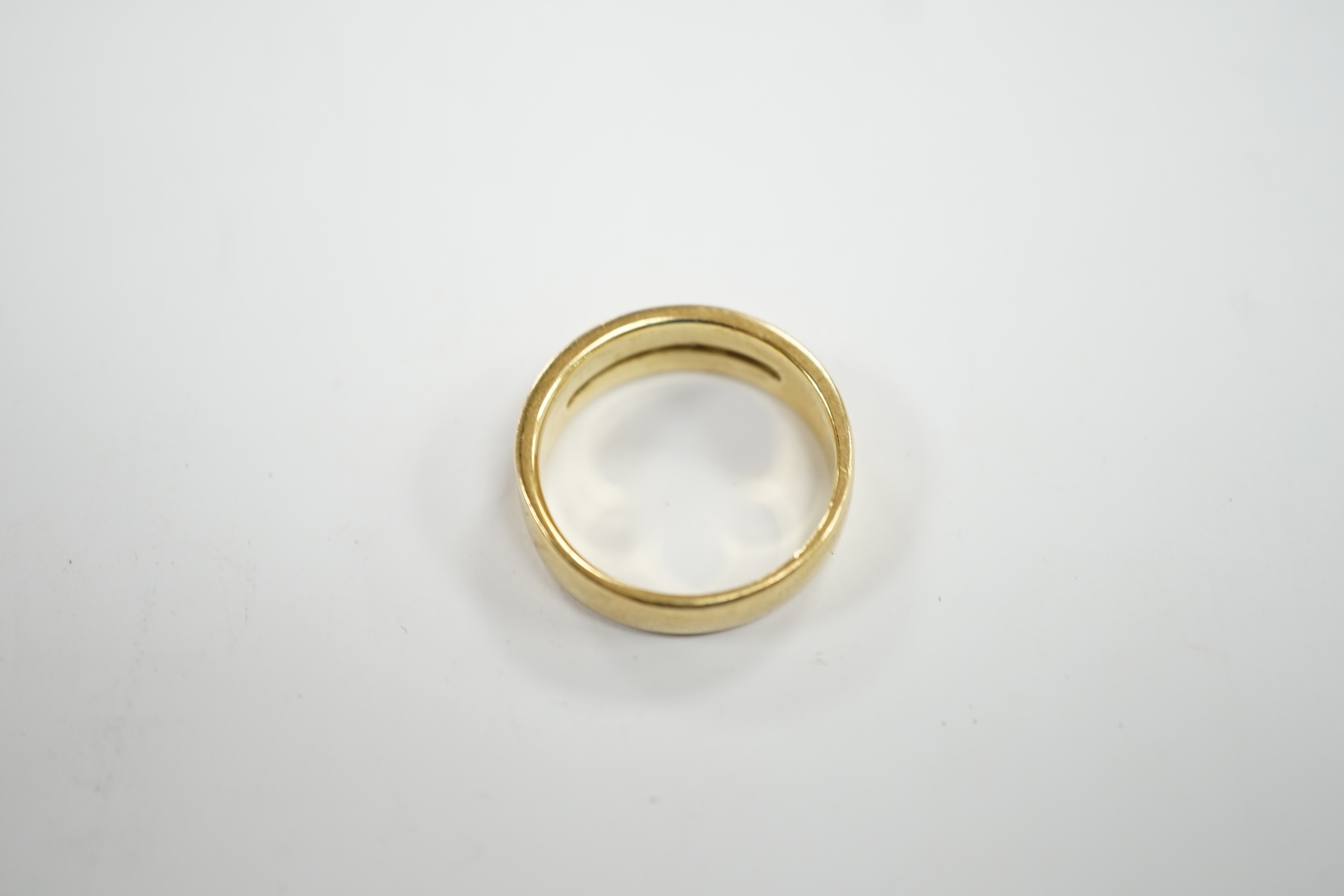 A modern 18ct gold and five stone diamond set half hoop ring, size O, gross weight 6.2 grams.